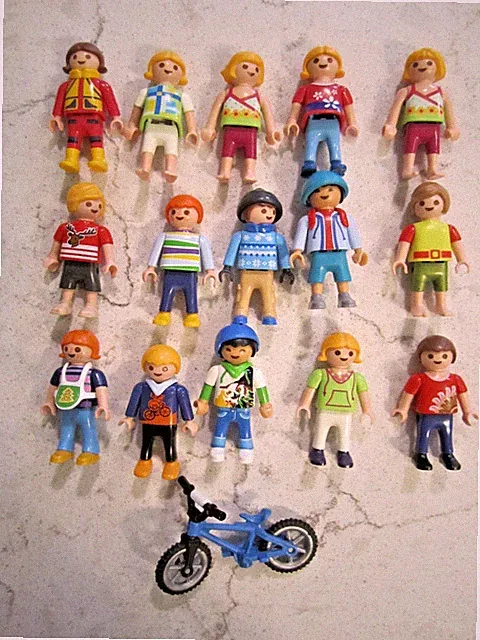 lot 15 playmobil Figures including world kids with bicycle